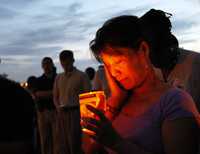 Vigilia en el lago Pontchartrain, en Nueva Orleáns, al conmemorarse el segundo aniversario de la devastación de la ciudad por el huracán Katrina
