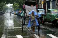 Triciclo rickshaw en Calcuta. Ayer estalló una huelga de consumidores en India y Malasia como protesta por el fuerte aumento de los precios de los combustibles. Opositores están llamando a extender el movimiento